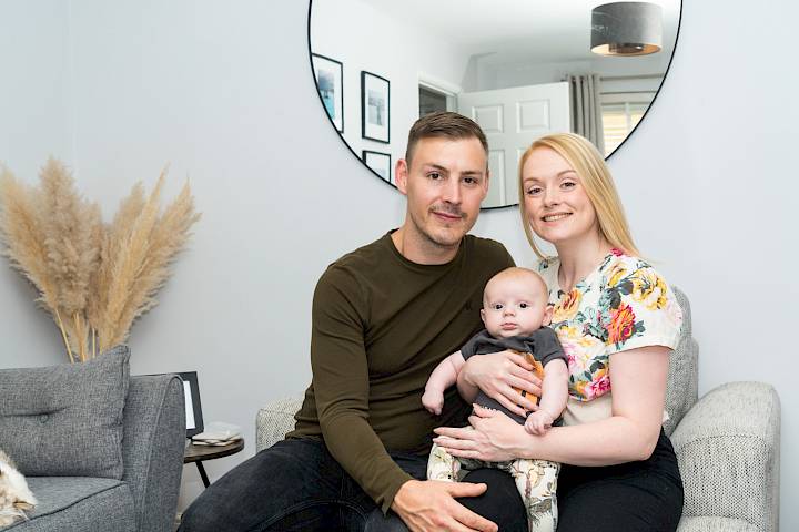 Couple with baby in the livingroom