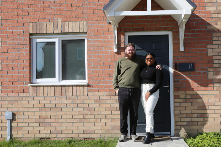 Couple stood at the front door