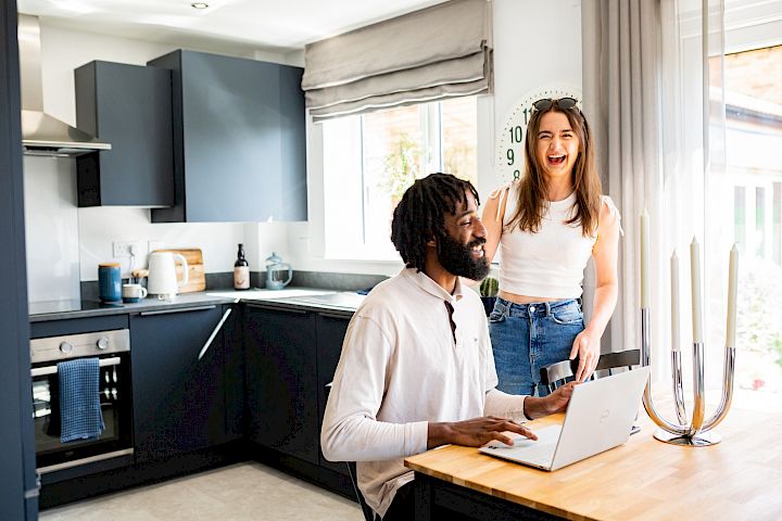 Young couple in the kitchen of their home