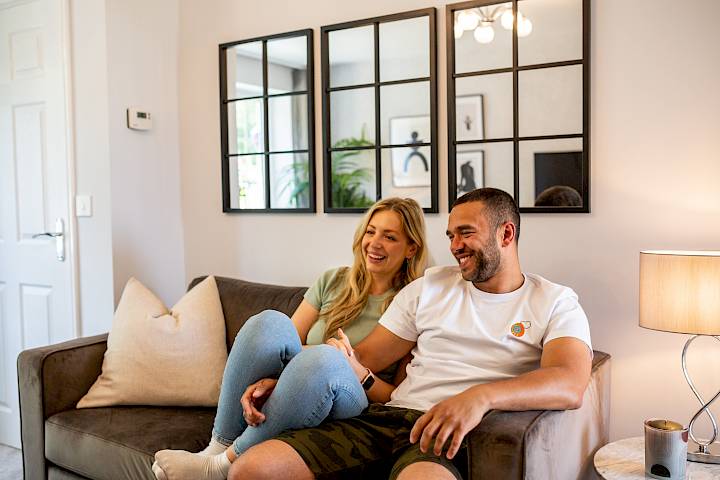 Young couple in the living room of their home