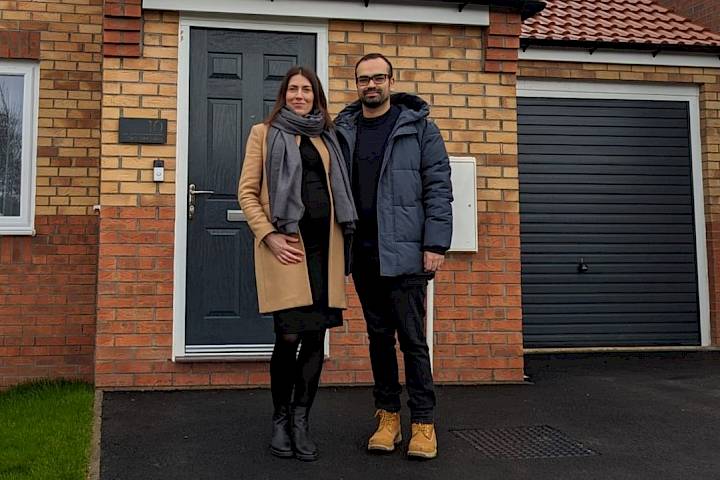 Couple at front of house