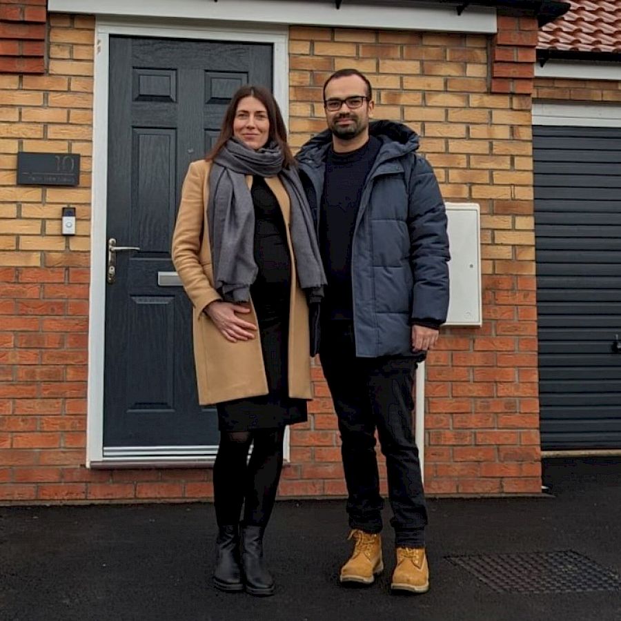 Couple at front of house