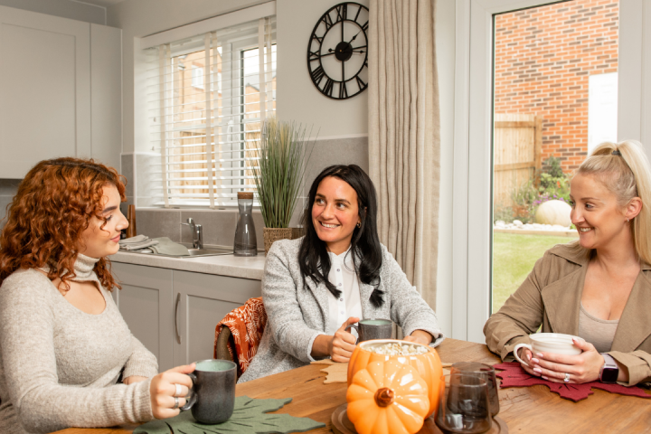 3 happy friends having a chat in a Gleeson kitchen